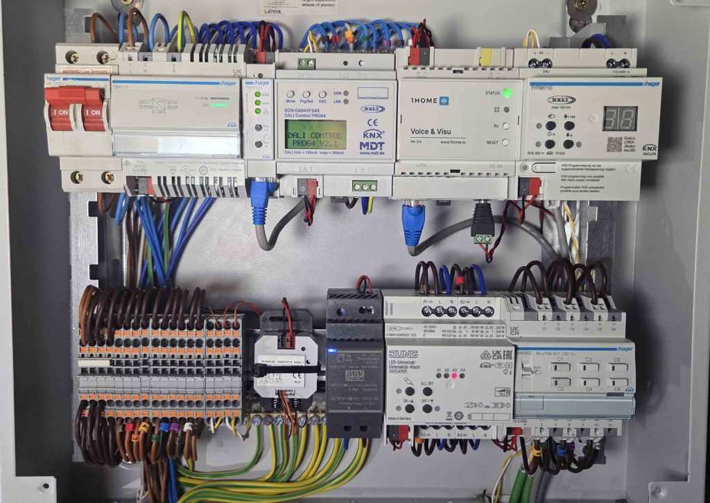KNX distribution board wired and commissioned by Smart Sparx, with Hager power supply, MDT DALI gateway, 1Home Voice and Visu bridge and JUNG dimmer on DIN rail
